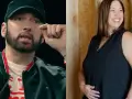 Eminem w czapce i czarnej kurtce obok uśmiechniętej kobiety w czarnej bluzce.