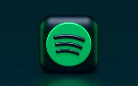 Ikona Spotify na ciemnozielonym tle.