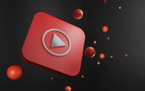 Czerwony przycisk play YouTube z unoszącymi się czerwonymi kulkami na czarnym tle.