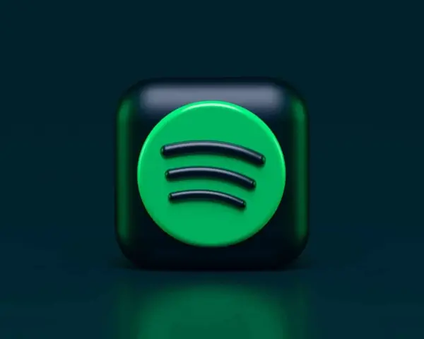 Ikona Spotify na ciemnozielonym tle.