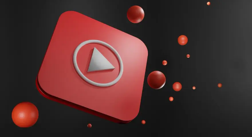 Czerwony przycisk play YouTube z unoszącymi się czerwonymi kulkami na czarnym tle.